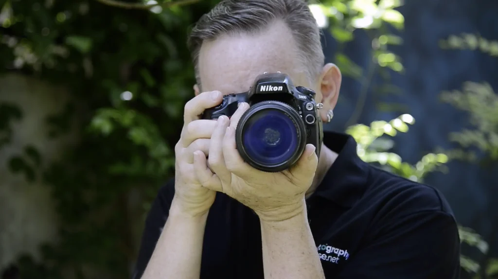 photographer holding a camera.