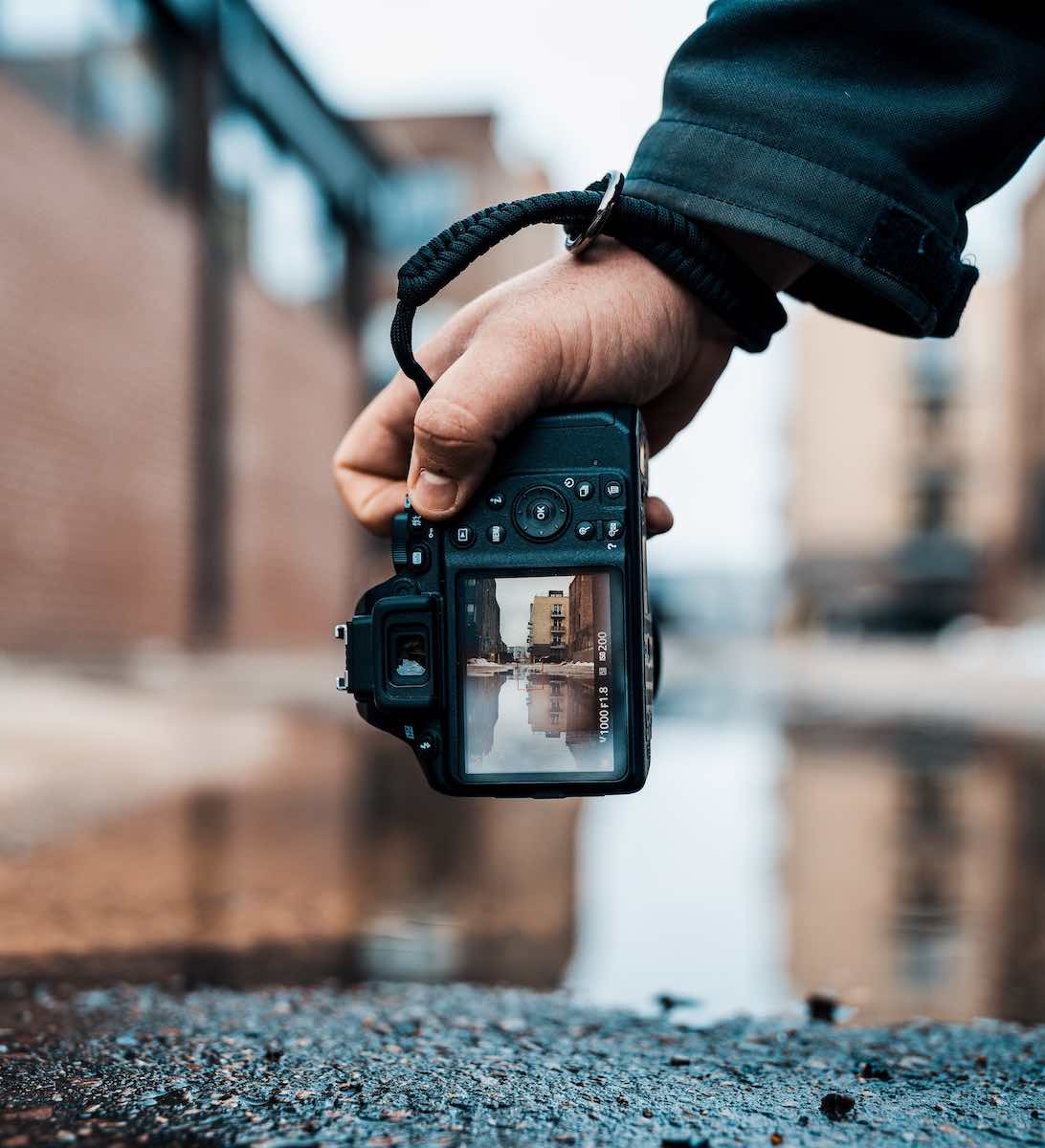 person holding camera in portrait orientation.