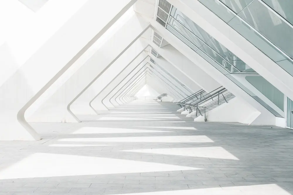 Modern interior architecture photography. Brightly-lit corridor in futuristically-designed building.