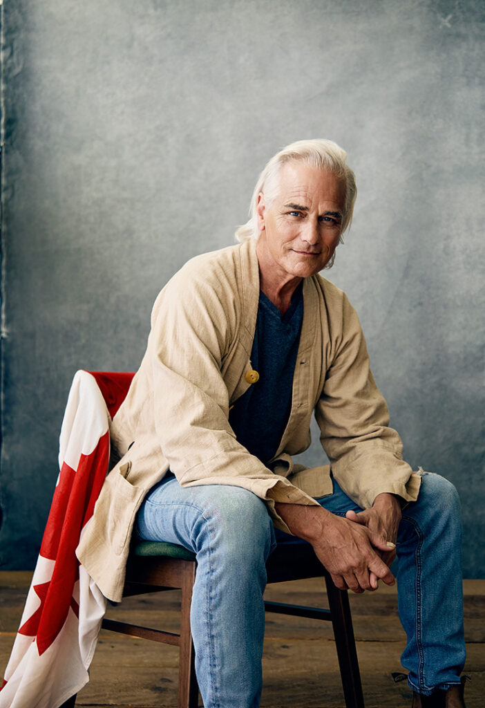 A portrait of a man sitting on a chair by Nick Wong.