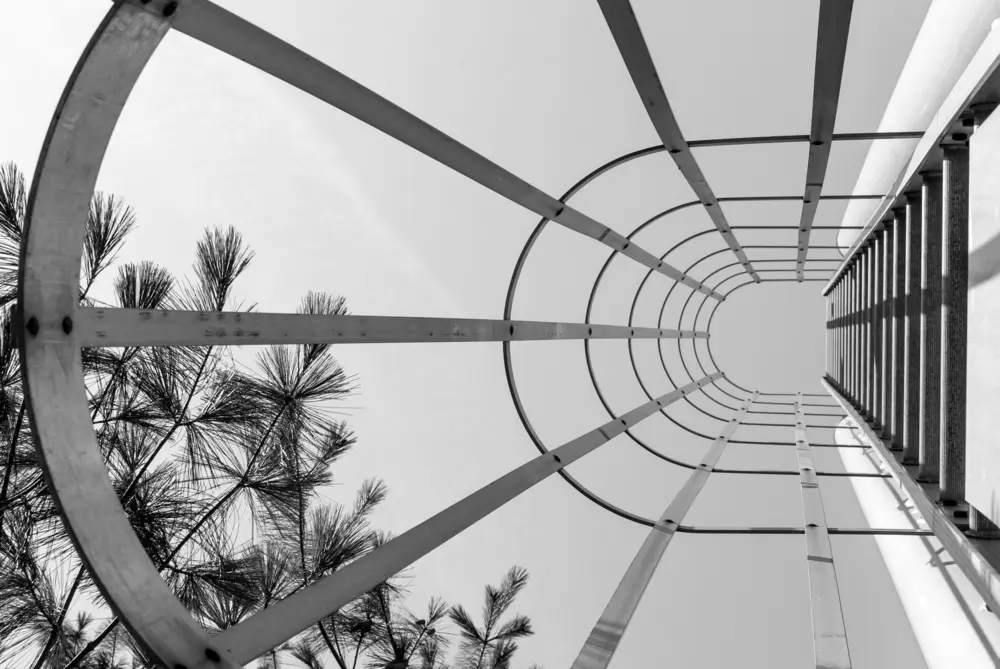 Abstract industrial ladder photographed in monochrome. An example of leading lines in street photography.
