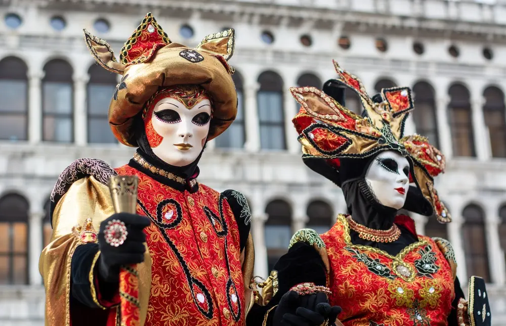 Masked couple attending the Venice carnival.
