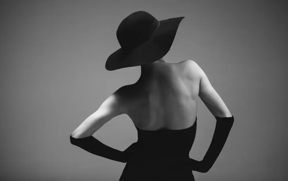 Black and white photo of a woman, highlighting the human element in art.