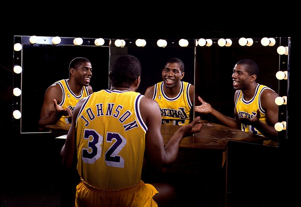 A photo of Magic Johnson in front of some mirrors by Chris Covatta.