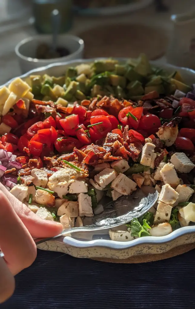 Colorful salad in warm afternoon light using smartphone portrait mode.
