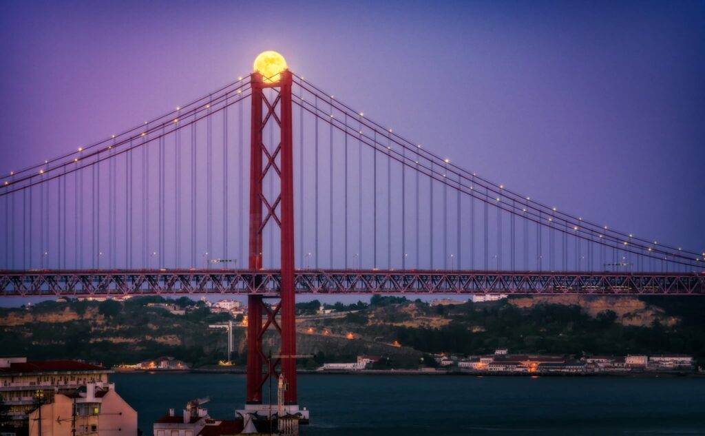 A photograph of a super moon over Lisbon, photographed by Nico Trinkhaus.