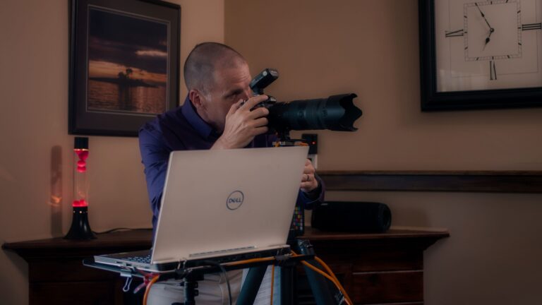 An image of Peter Istvan holding up a camera.
