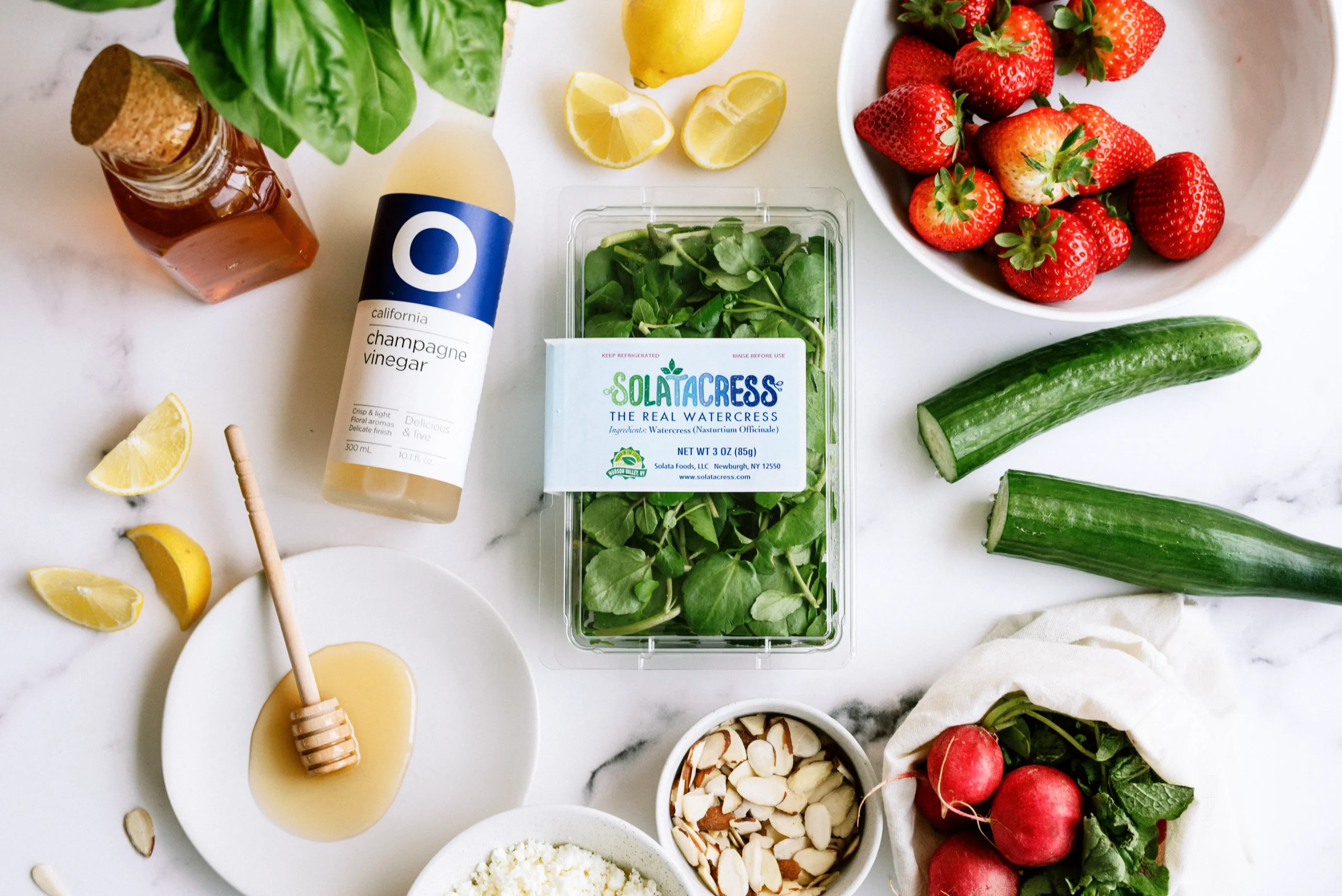 flat lay showing packaged greens centered among fresh ingredients to keep the product clearly visible and in focus.