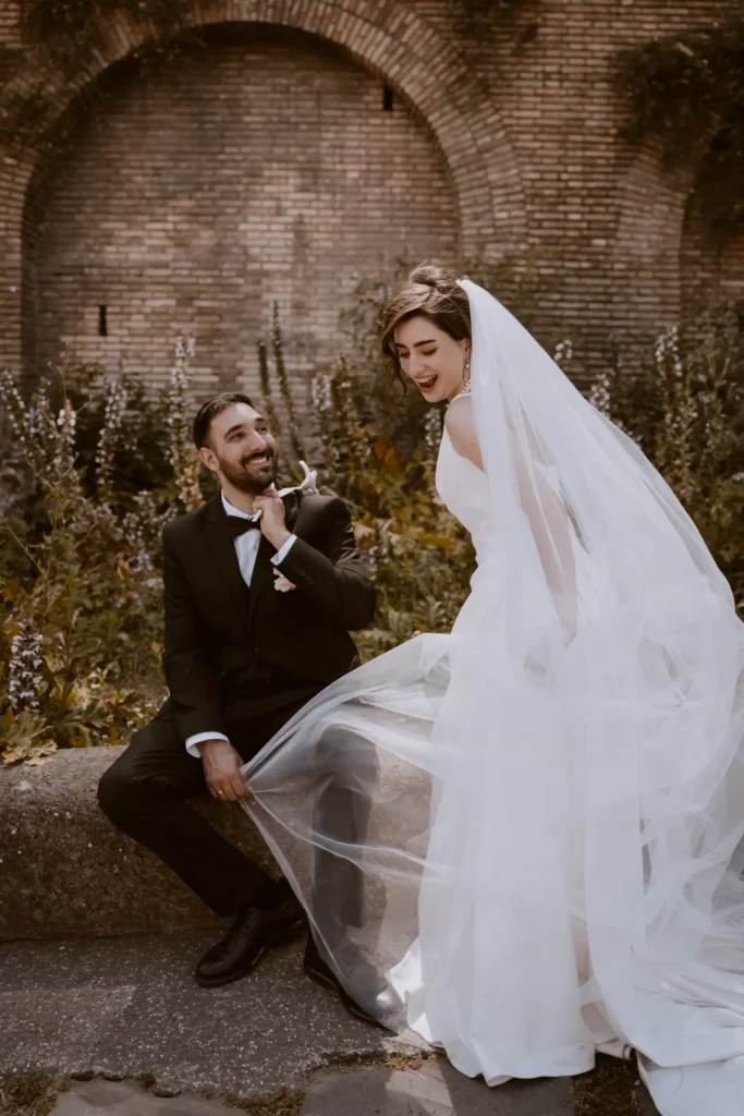 An image of a candid wedding moment between bride and groom by Lucrezia Bastoni.