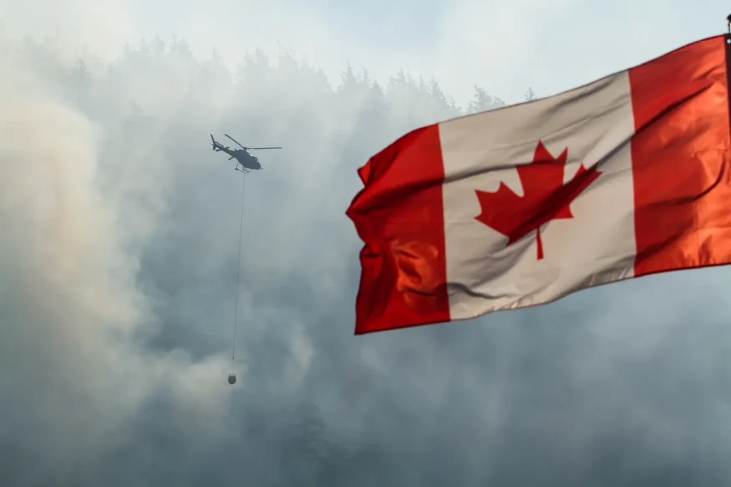 An image of a helicopter transferring water for a forest fire by Jillian Brown.