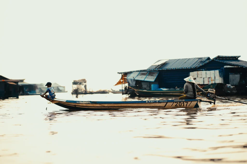 An image of two people on a boat by Paulie Marechal.