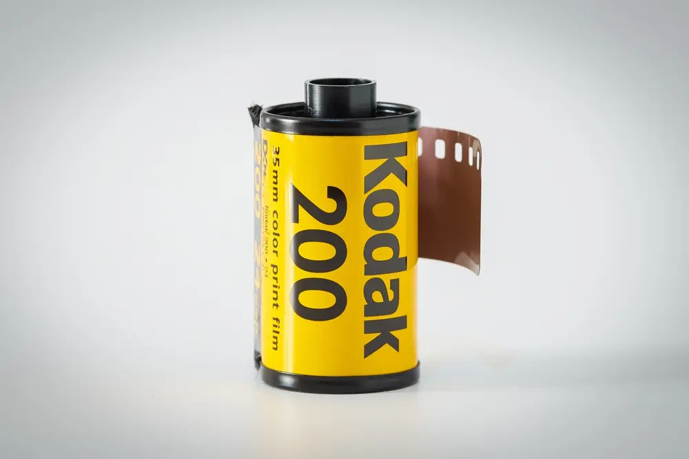 A yellow roll of camera film by Kodak.