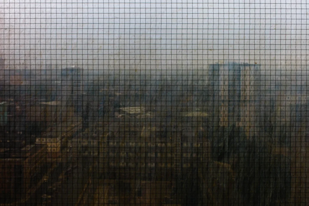 An image of a cityscape through a screen by Ben Smith