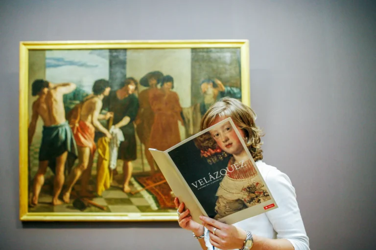 An image of someone in an art gallery behind a book in a portrait by Ben Smith,