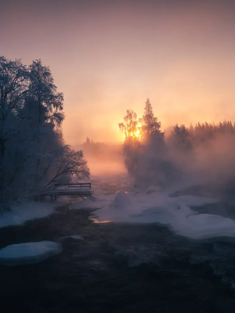 A misty, cold sunrise image of a river by Kasper Rajasuo.