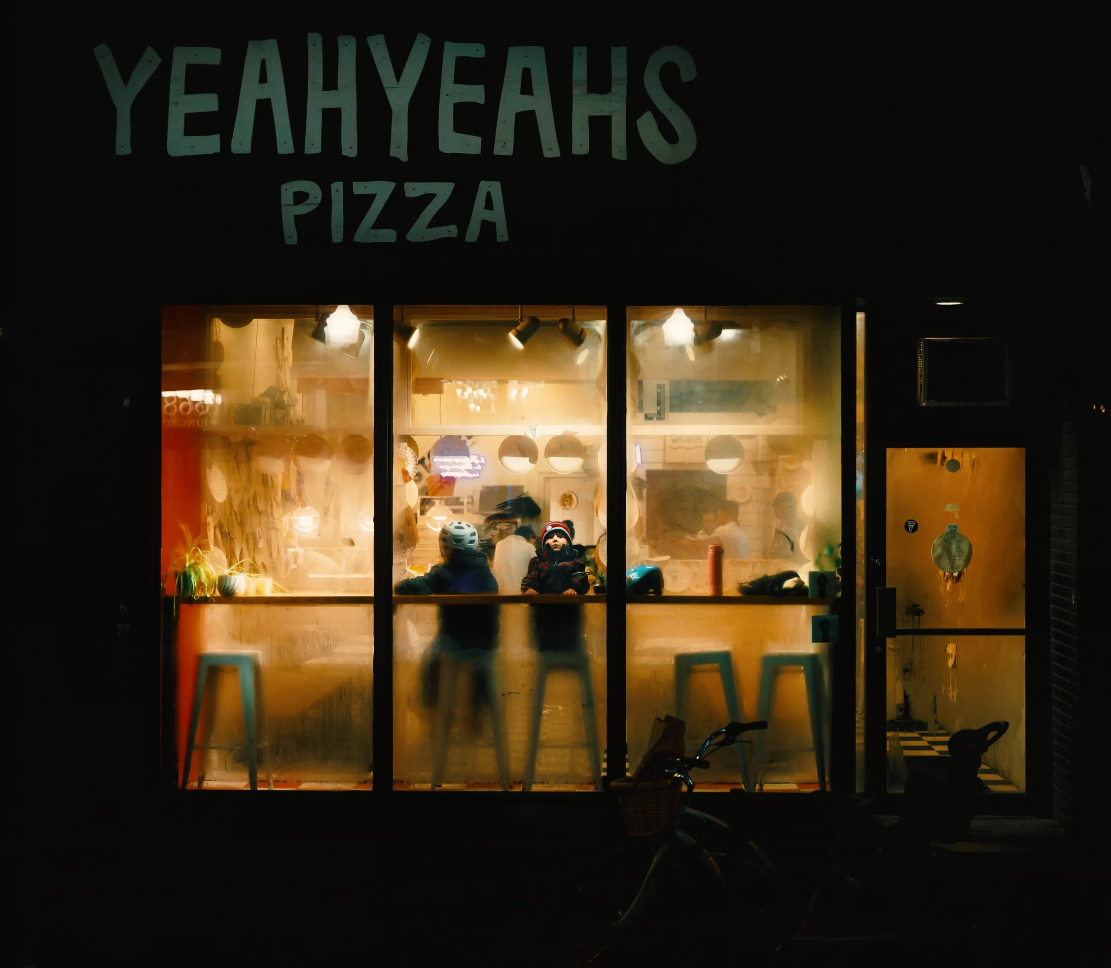 A photograph of a pizza restaurant in winter by Thomas Luscombe.