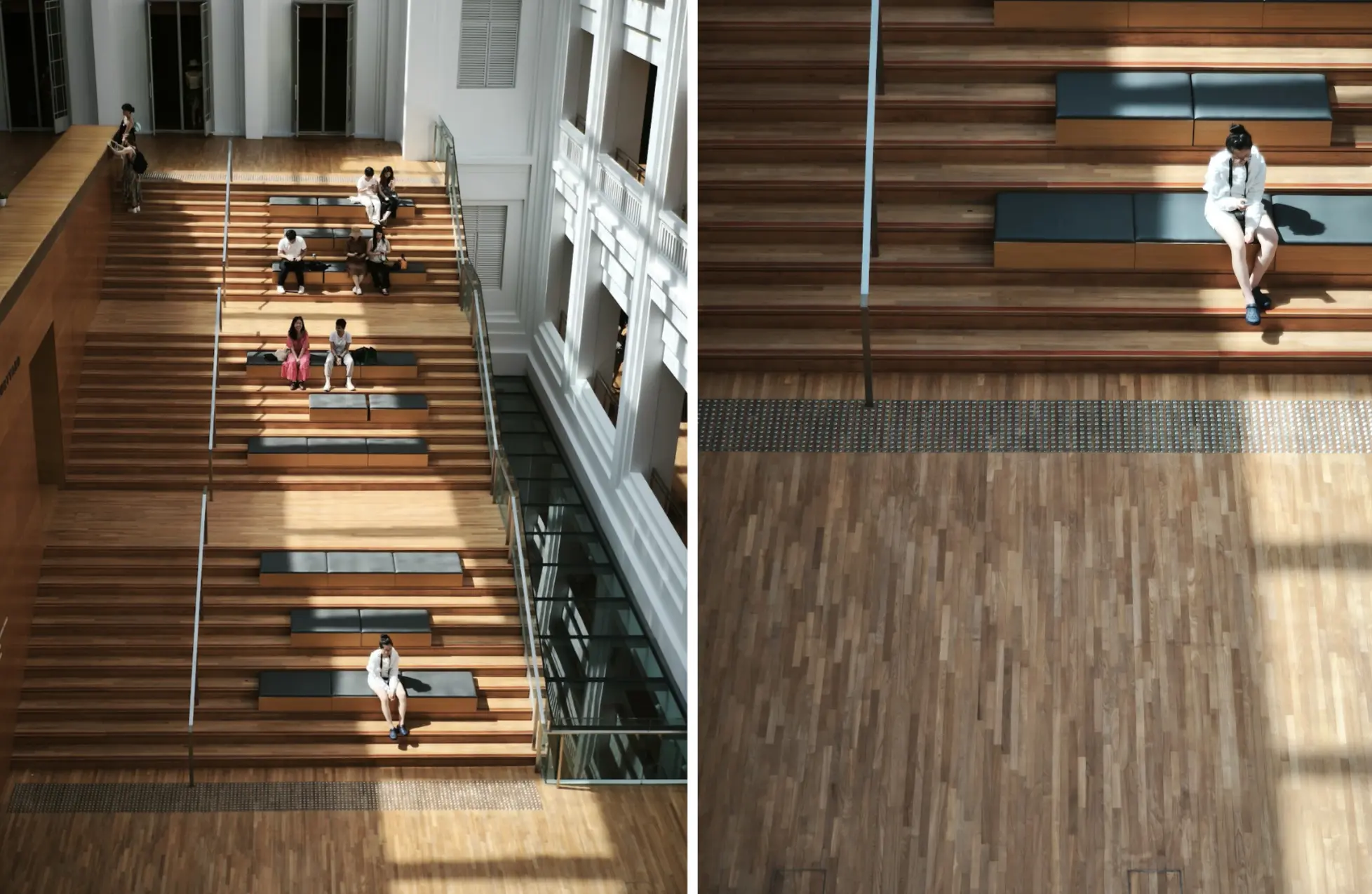 Overhead view of people seated on tiered wooden steps inside a modern public building, illustrating human scale within architectural space.