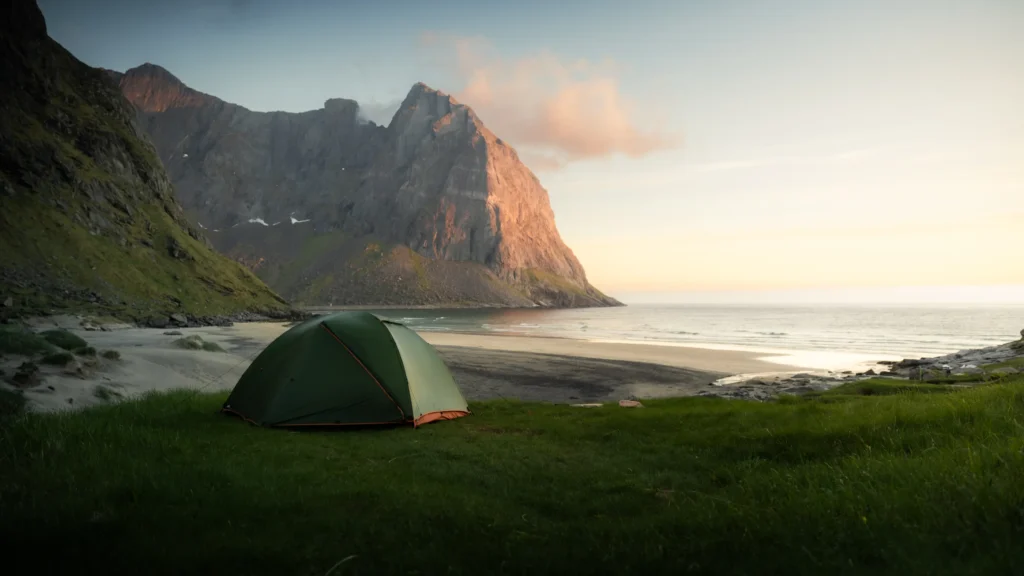 An image of a lone tent on the shores of a large body of water by Matti Seppänen