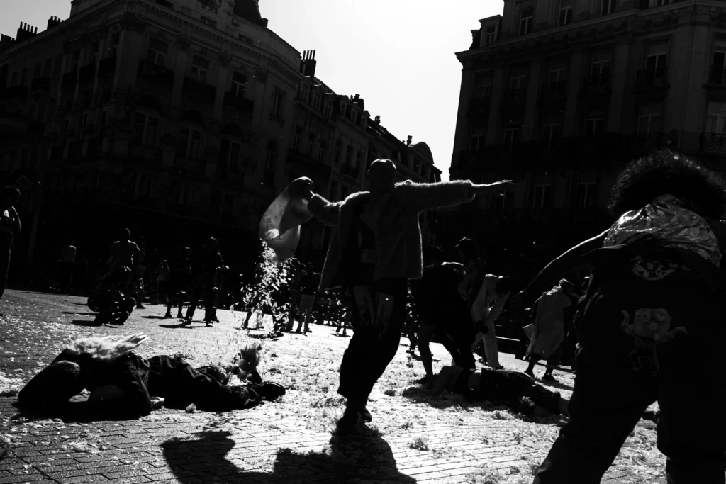 A silhouetted street image of protesters by Frederic Paulussen.