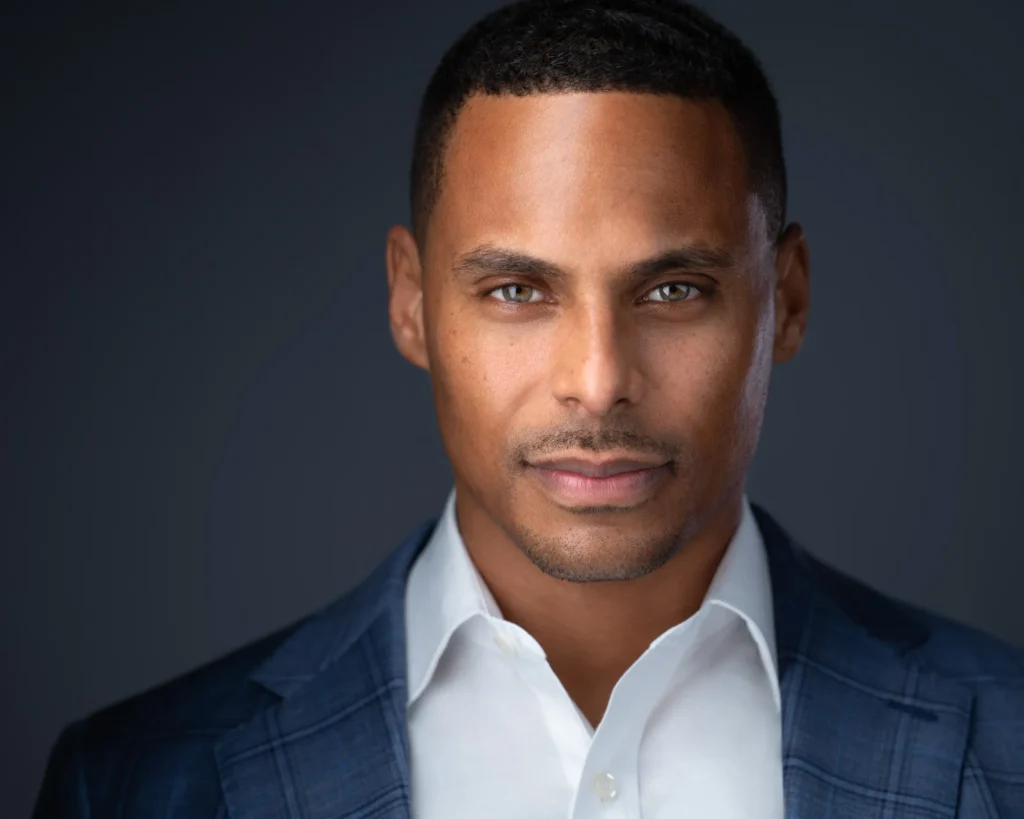 A portrait of a man with a side lit face by Daniel Wakefield.