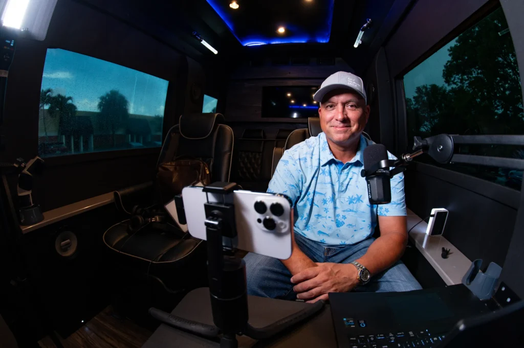 A photograph of someone sitting in a limo with recording equipment around them by Daniel Wakefield