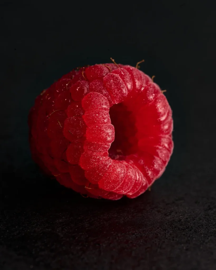A close up of a raspberry by Anusha Stewart.