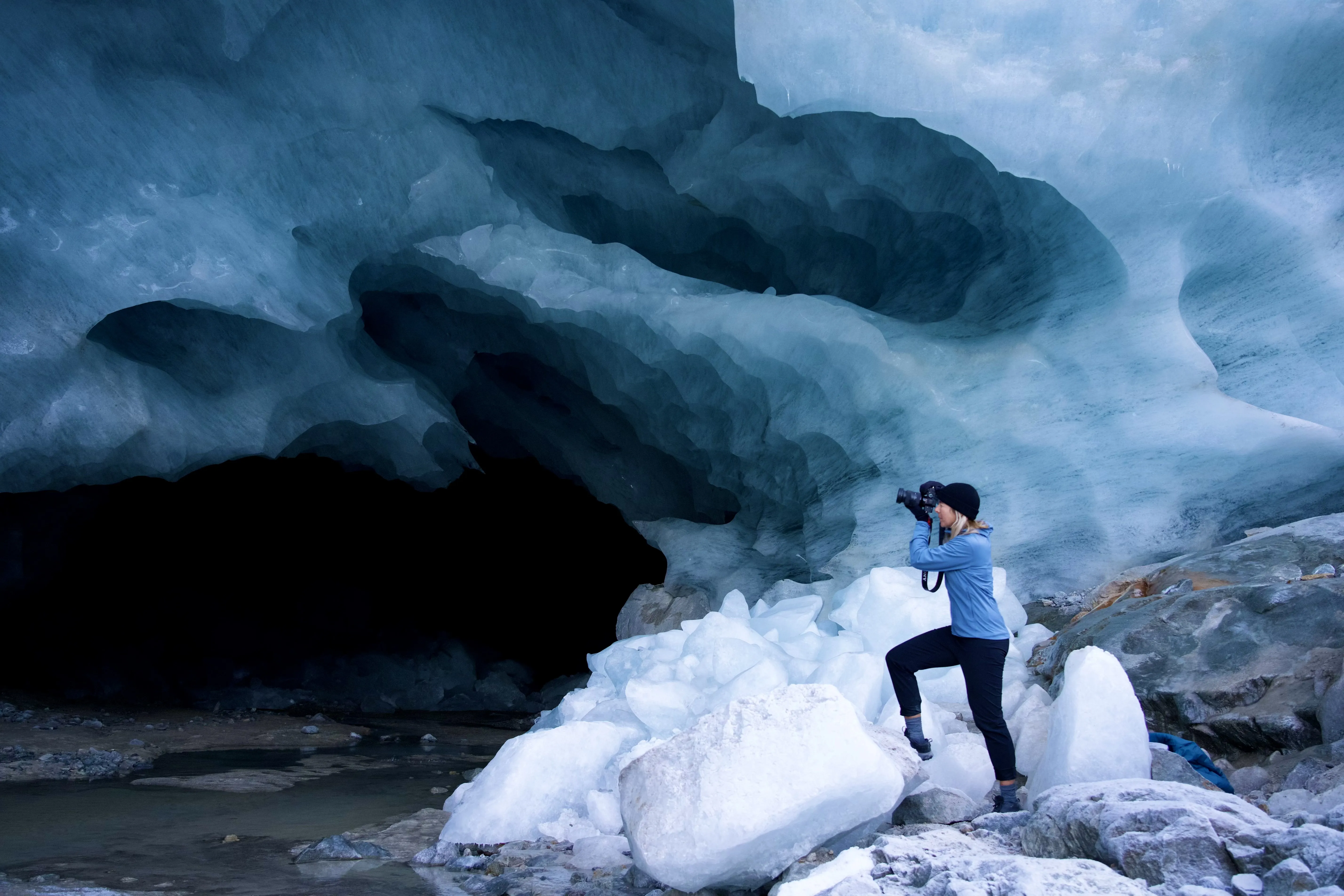 An image of mountaineer Alexandra Nemeth photographing a glacier.